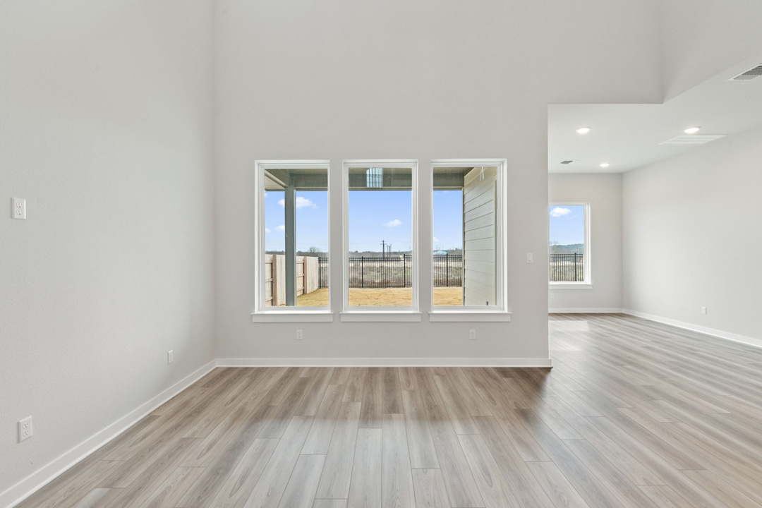 16209 Smithers Road Manor, TX 78653 - Photo 13 of 38 wooden floor in an empty room with a window