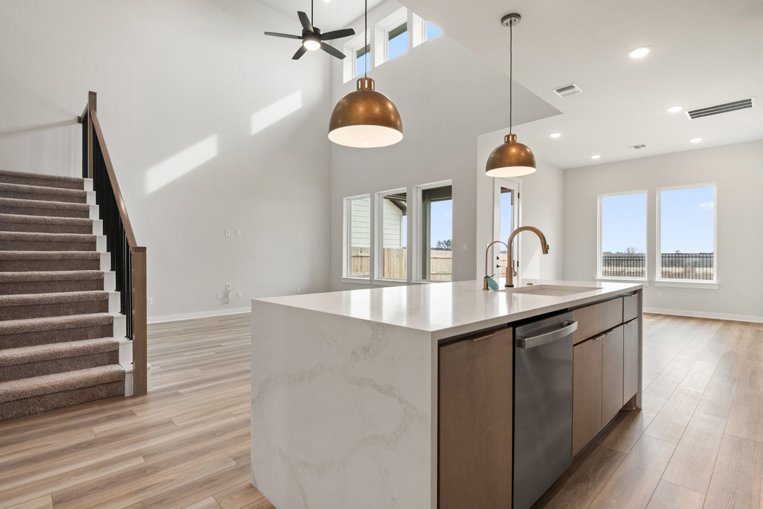16209 Smithers Road Manor, TX 78653 - Photo 14 of 38 a kitchen with stainless steel appliances granite countertop a sink a stove a refrigerator and wooden floor