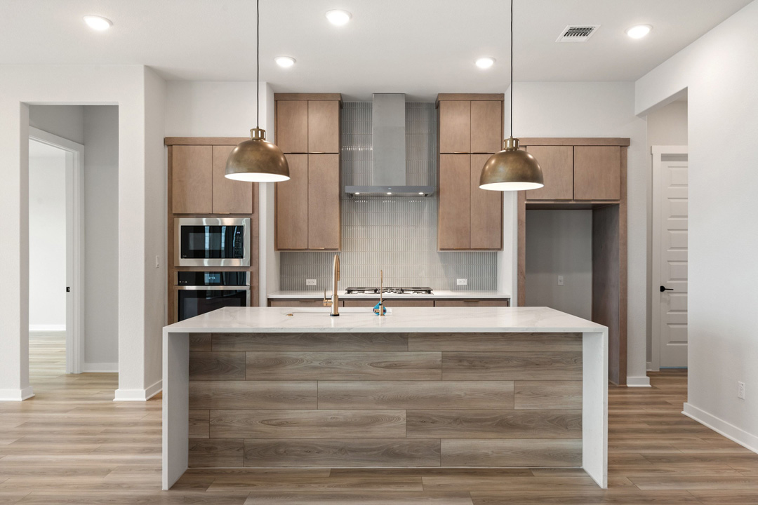 16209 Smithers Road Manor, TX 78653 - Photo 15 of 38 a view of kitchen with kitchen island sink and refrigerator