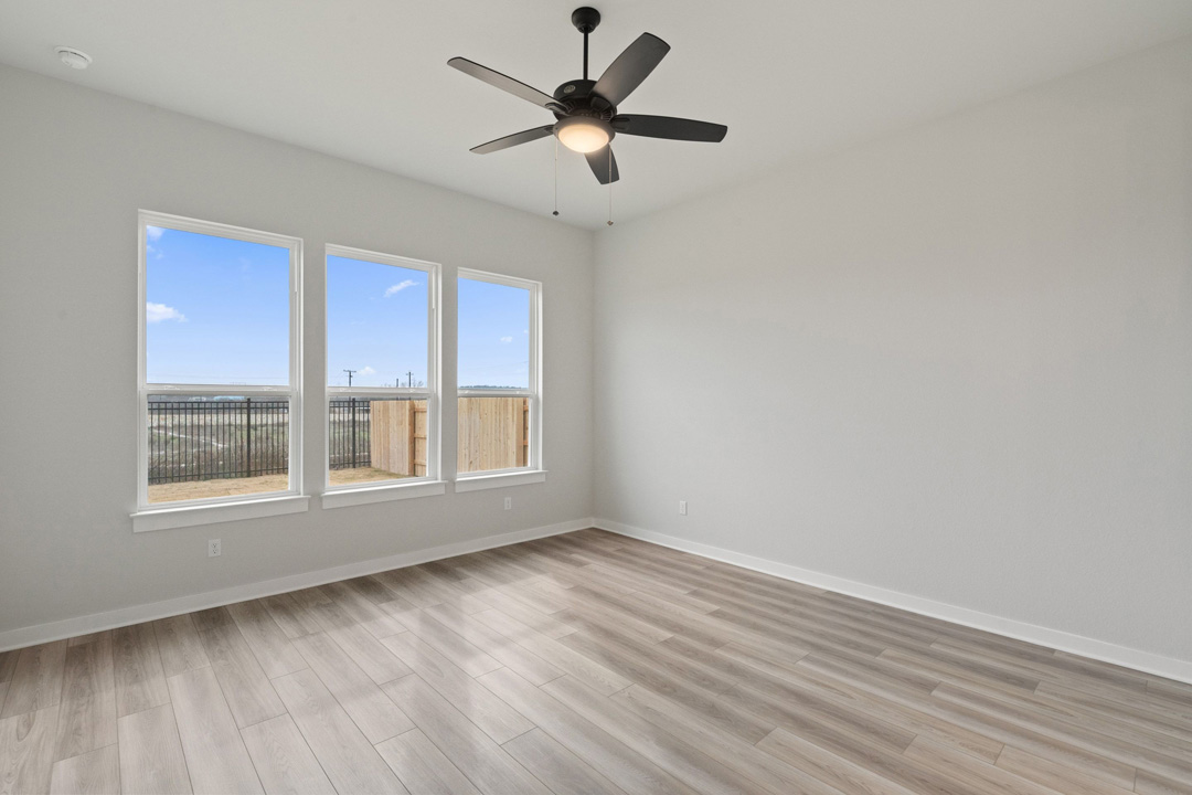 16209 Smithers Road Manor, TX 78653 - Photo 19 of 38 wooden floor in an empty room with a window