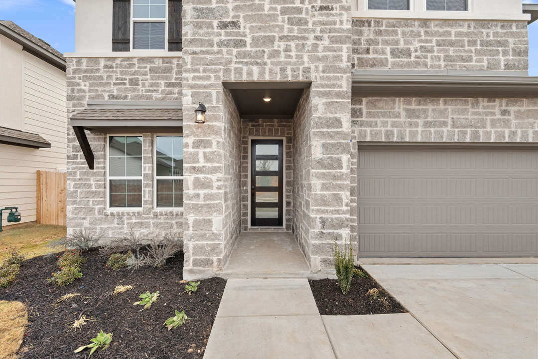 16209 Smithers Road Manor, TX 78653 - Photo 2 of 38 a front view of a house with a large window