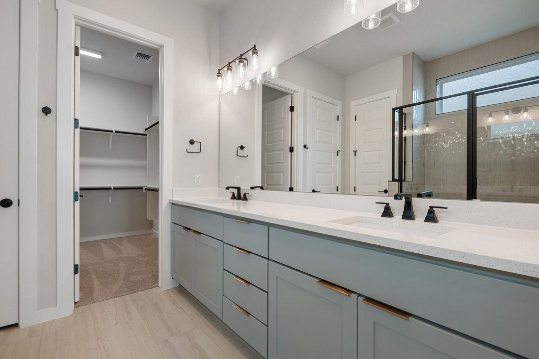 16209 Smithers Road Manor, TX 78653 - Photo 21 of 38 a bathroom with a double vanity sink mirror and double