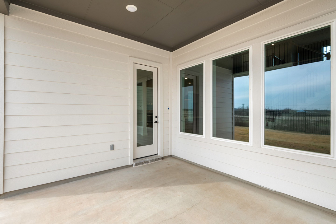 16209 Smithers Road Manor, TX 78653 - Photo 33 of 38 a view of a porch with a door