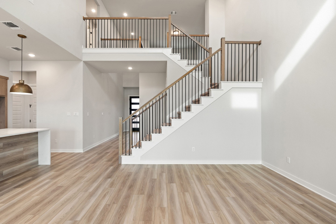 16209 Smithers Road Manor, TX 78653 - Photo 10 of 38 a view of a hallway with wooden floor and entryway