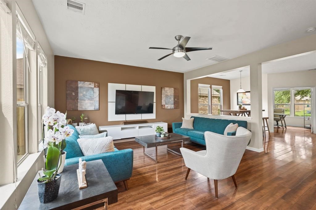 6719 Path Way Court Katy, TX 77449 - Photo 11 of 35 a living room with furniture fireplace and a flat screen tv