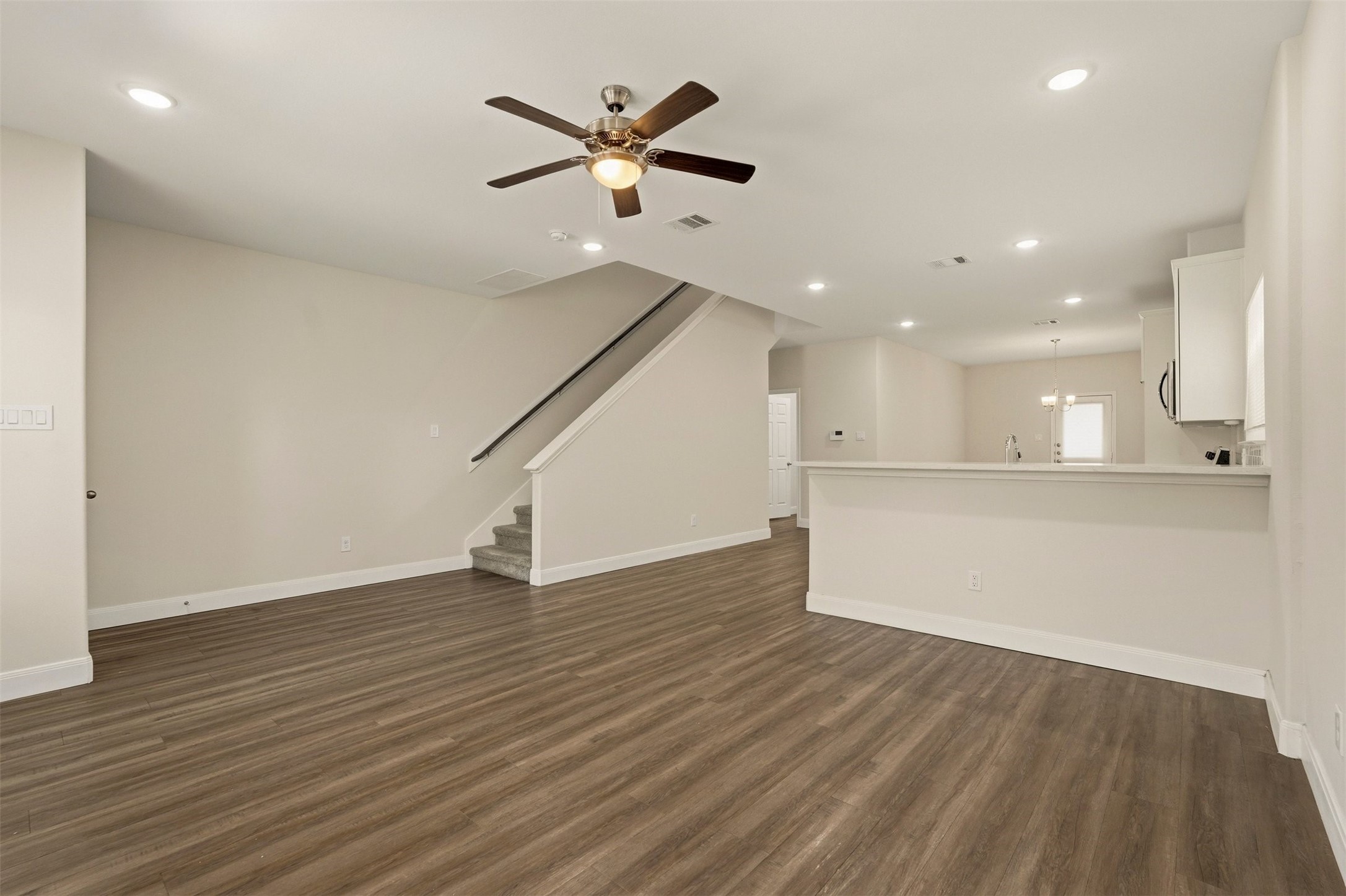 2218 Bringhurst Street, Unit B Houston, TX 77026 - Photo 4 of 25 an empty room with wooden floor and windows