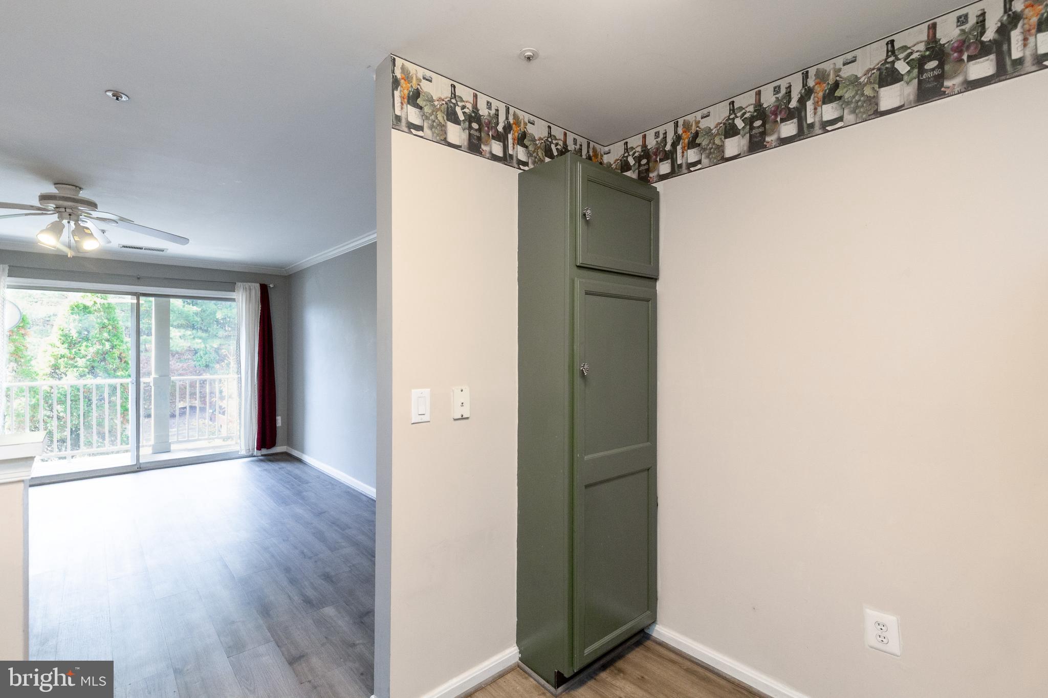 1049 Gardenview Loop, Unit 301 Woodbridge, VA 22191 - Photo 13 of 25 a view of a room with wooden floor and windows