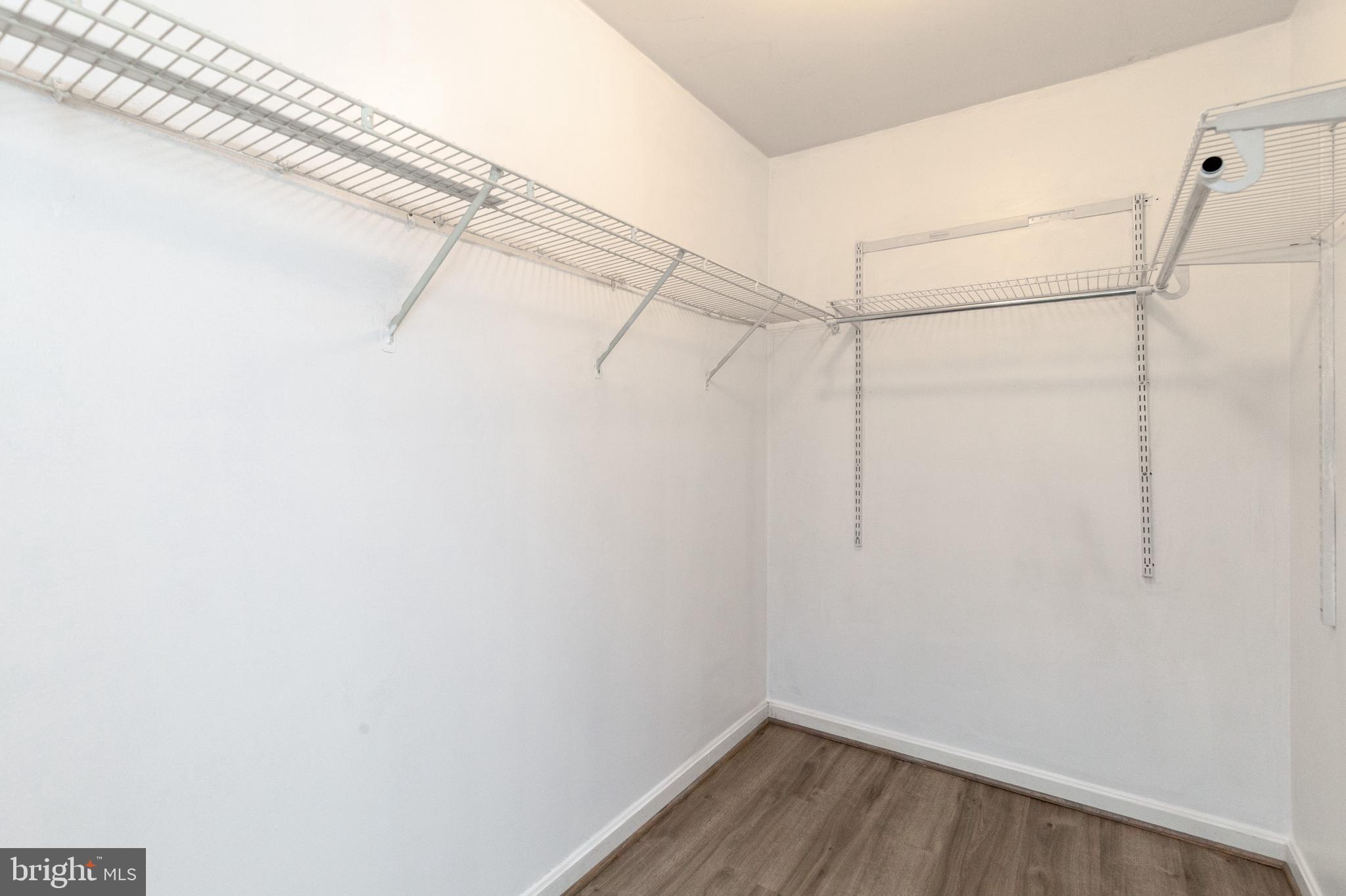 1049 Gardenview Loop, Unit 301 Woodbridge, VA 22191 - Photo 23 of 25 a view of a room with racks on the wall