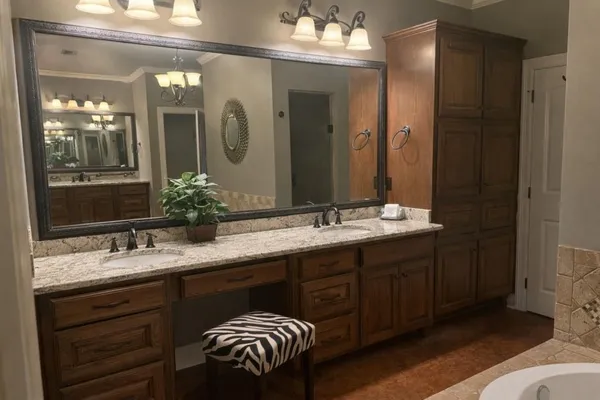 a bathroom with a double vanity sink and a mirror