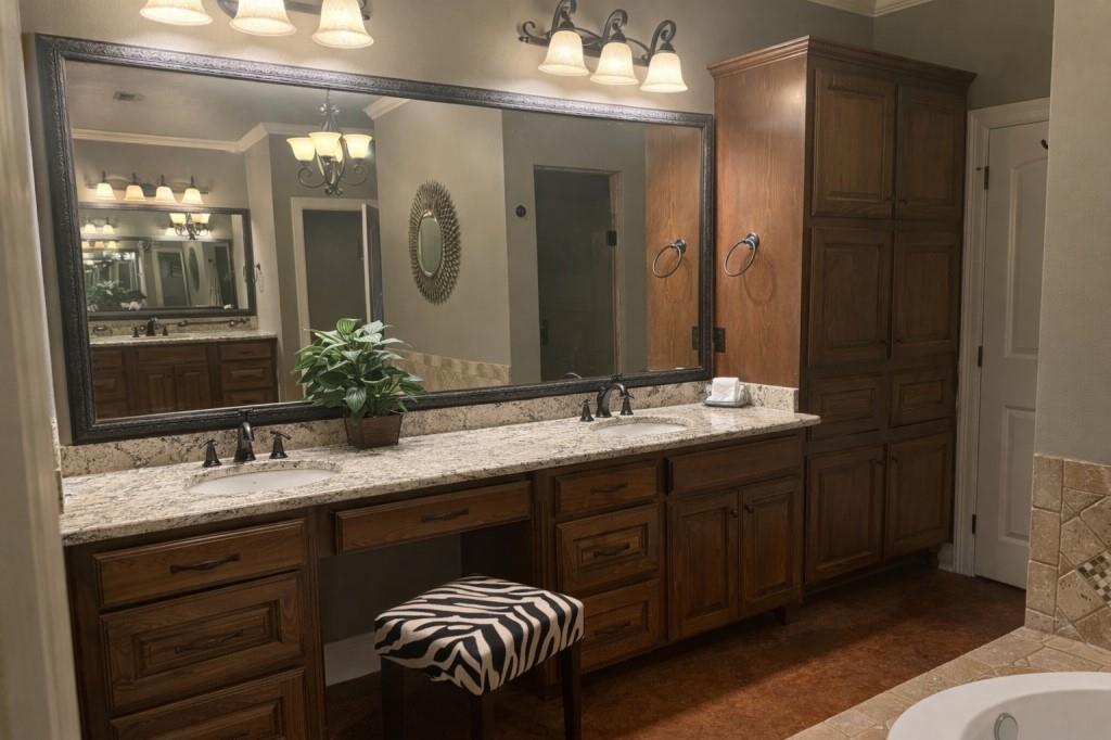 252 Tanner Street Stonewall, LA 71078 - Photo 14 of 34 a bathroom with a double vanity sink and a mirror