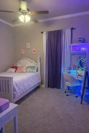 a bedroom with a bed and a table