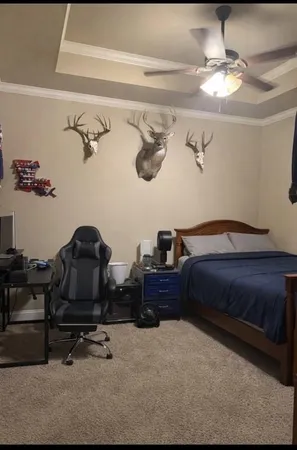 a bedroom with a bed and cabinets