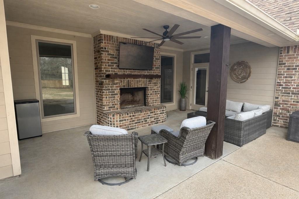 252 Tanner Street Stonewall, LA 71078 - Photo 30 of 34 a living room with furniture and a fireplace