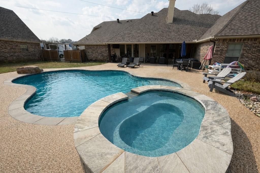 252 Tanner Street Stonewall, LA 71078 - Photo 3 of 34 an outdoor view with swimming pool and seating space