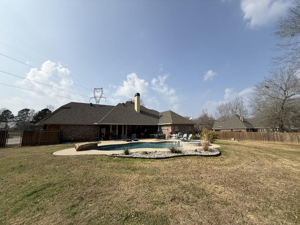 252 Tanner Street Stonewall, LA 71078 - Photo 31 of 34 a front view of a house with garden