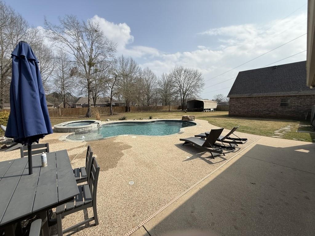 252 Tanner Street Stonewall, LA 71078 - Photo 32 of 34 a view of a swimming pool and lounge chair