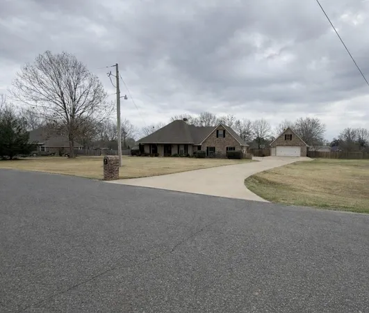a view of outdoor space with playground and green space