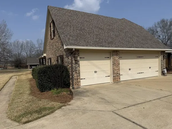 a front view of a house with a garage