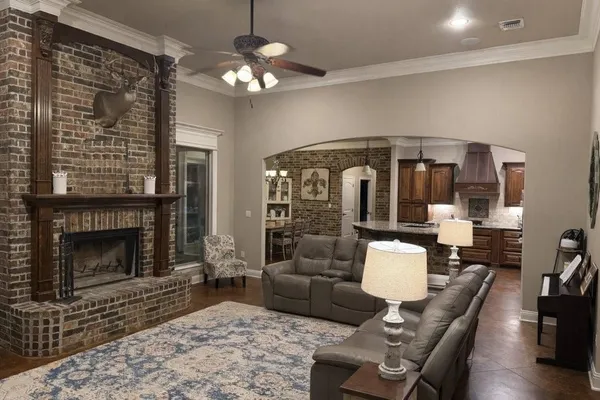 a living room with furniture and a fireplace