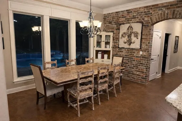 a dining room with furniture and window