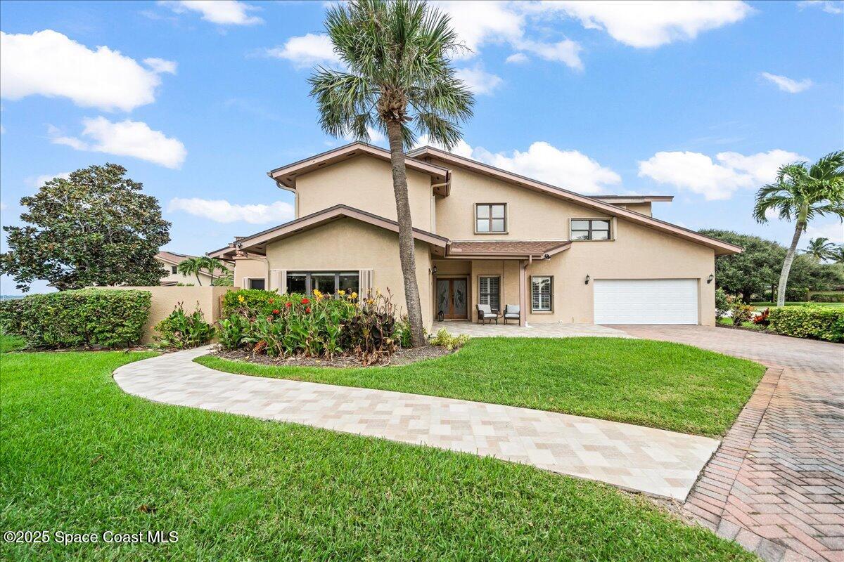 208 The Road, Unit C2 Melbourne Beach, FL 32951 - Photo 45 of 65 Paverwalk way to side of home