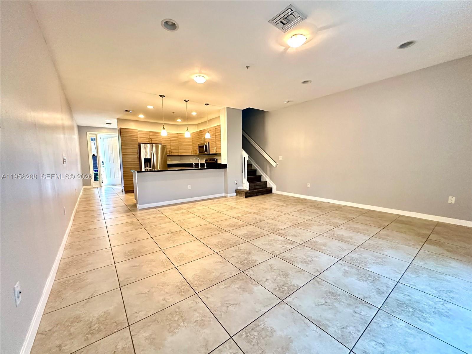 2574 Southwest 81st Terrace, Unit 2564 Miramar, FL 33025 - Photo 2 of 19 a view of a hall with wooden floor