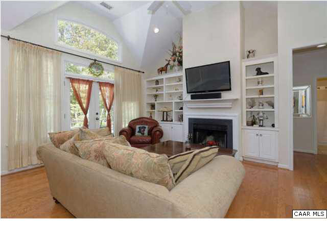 12 Ridgeway Farm Drive Keswick, VA 22947 - Photo 7 of 21 a living room with a flat screen tv and a fireplace