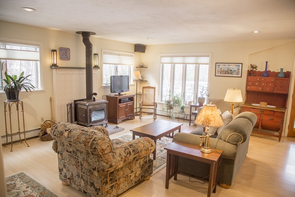 275 Littleton Road Harvard, MA 01451 - Photo 12 of 17 a living room with furniture and a large window