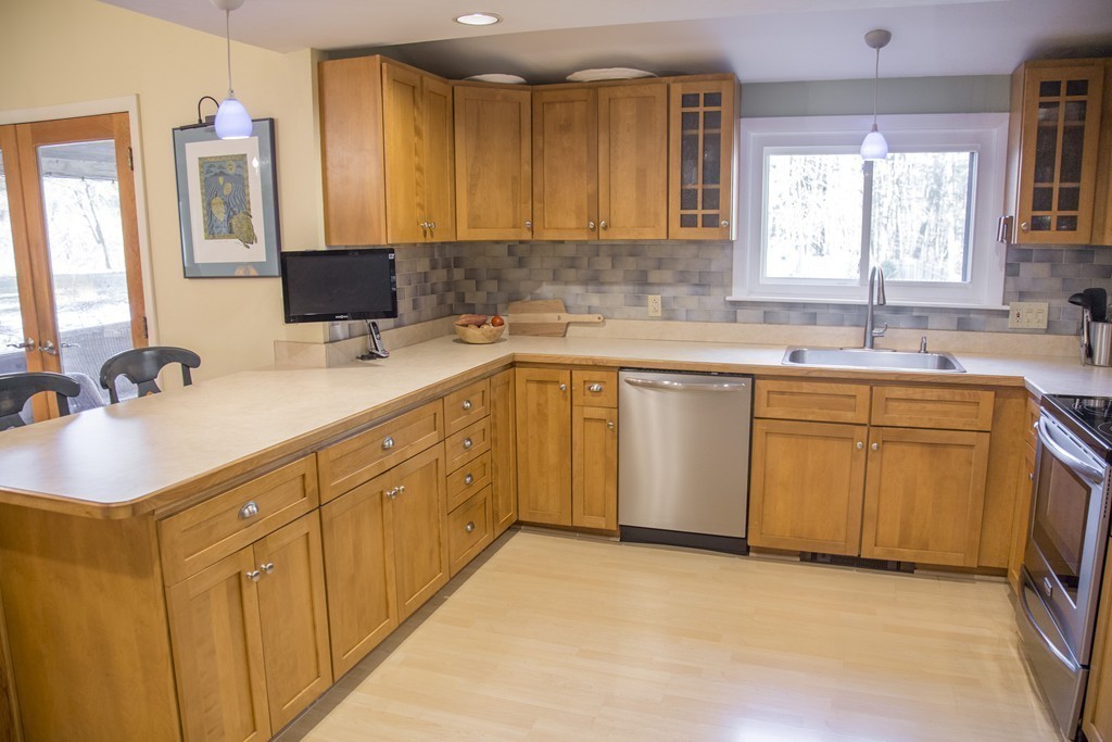 275 Littleton Road Harvard, MA 01451 - Photo 5 of 17 a kitchen with a sink stove and cabinets