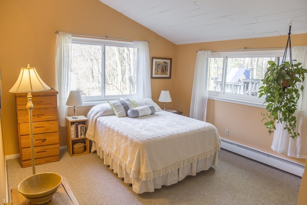 275 Littleton Road Harvard, MA 01451 - Photo 9 of 17 a bedroom with a bed and a potted plant