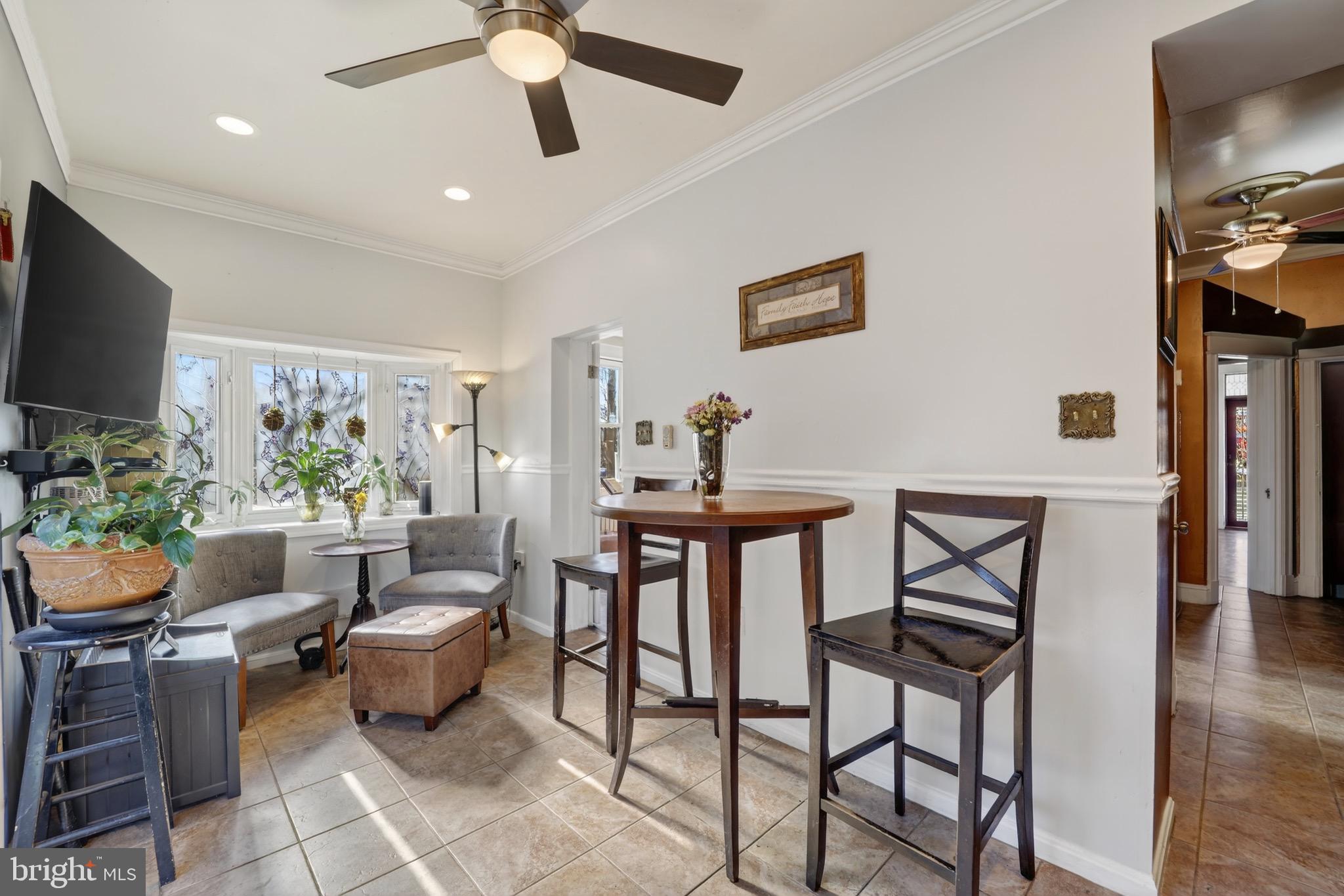 4301 4th Street Northwest Washington, DC 20011 - Photo 19 of 65 a living room with furniture a flat screen tv and a window