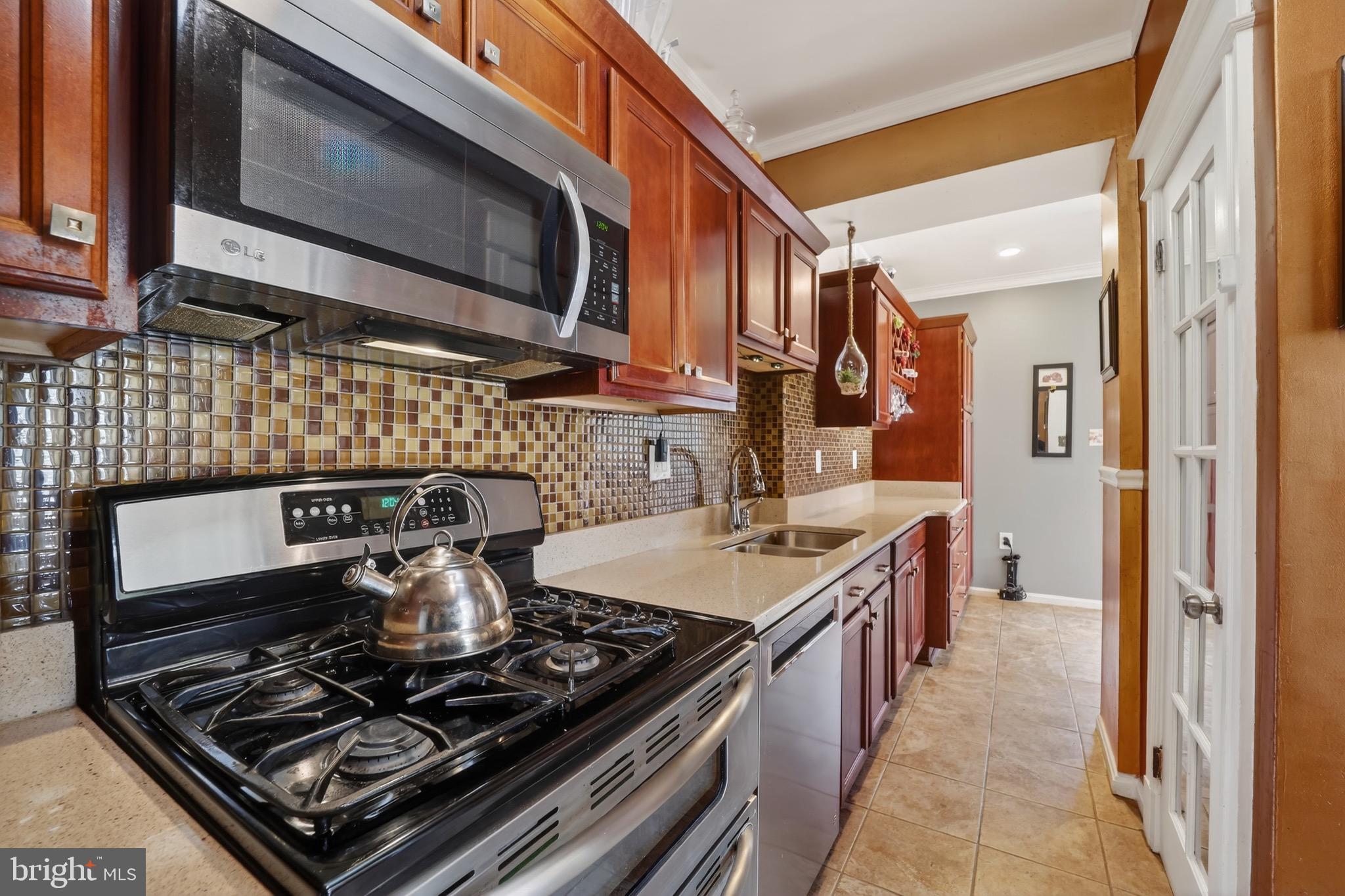 4301 4th Street Northwest Washington, DC 20011 - Photo 20 of 65 a kitchen with a stove and a microwave