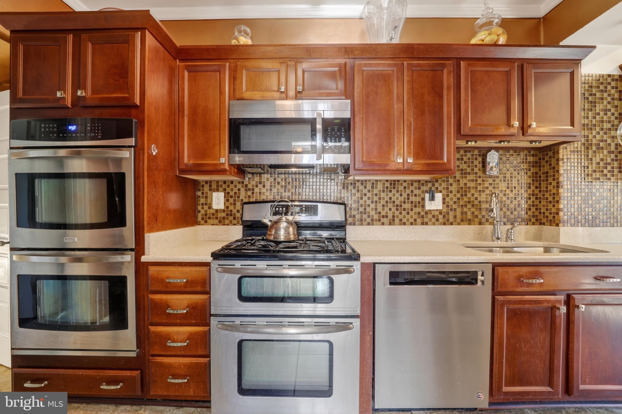 4301 4th Street Northwest Washington, DC 20011 - Photo 23 of 65 a kitchen with granite countertop a stove and a microwave