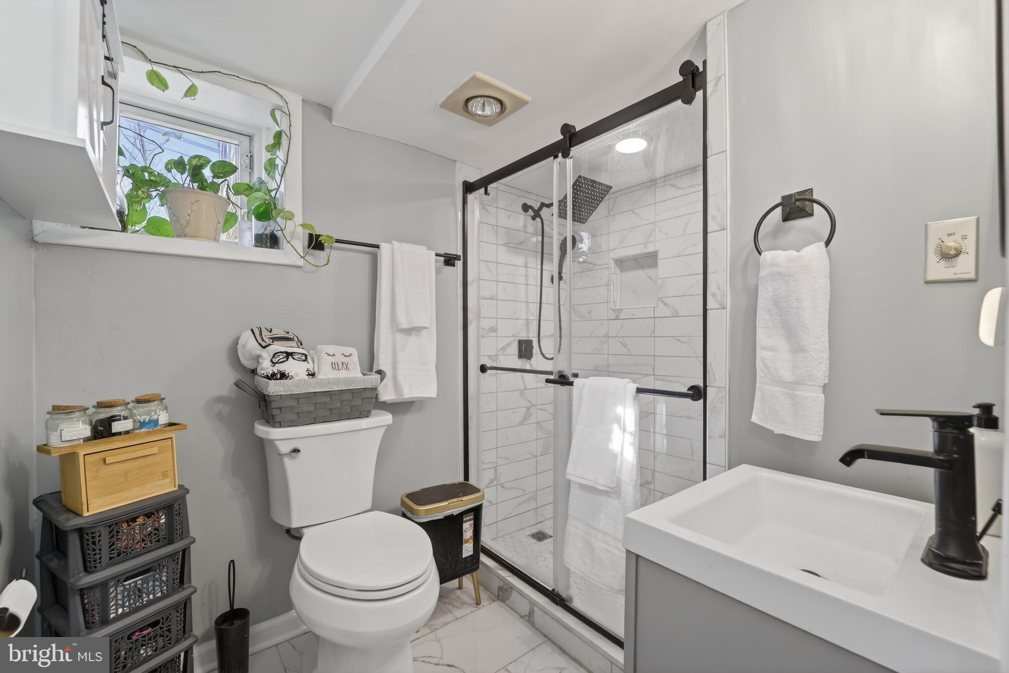 4301 4th Street Northwest Washington, DC 20011 - Photo 46 of 65 a bathroom with a sink toilet and shower