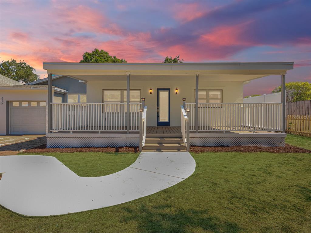 a view of a house with swimming pool and porch
