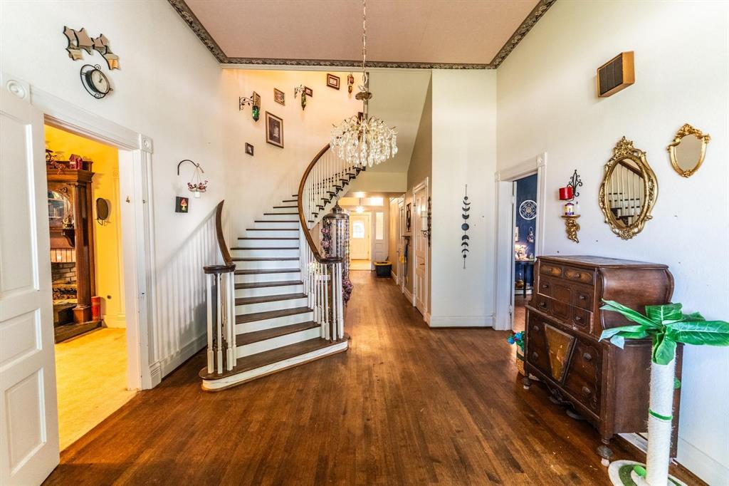 a view of an entryway with wooden floor