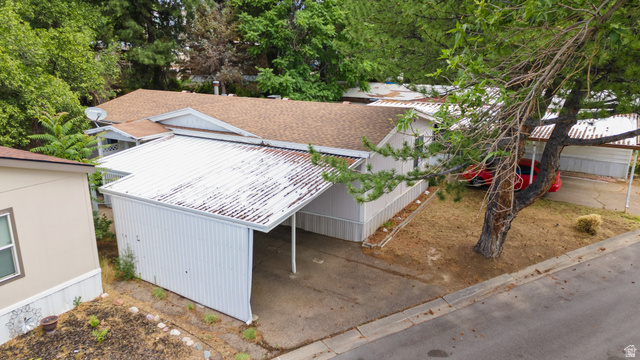 2875 North 400 West, Unit 7 Layton, UT 84041 - Photo 23 of 29 Single-story property featuring a carport with a corrugated metal roof