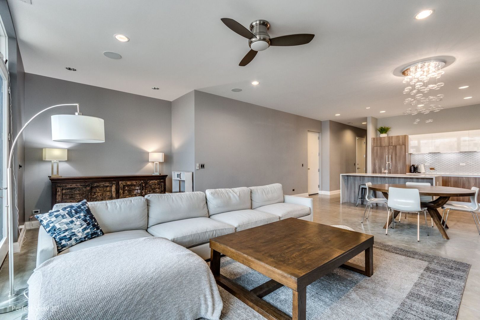 Undisclosed Address Chicago, IL 60622 - Photo 2 of 24 a living room with furniture and a chandelier