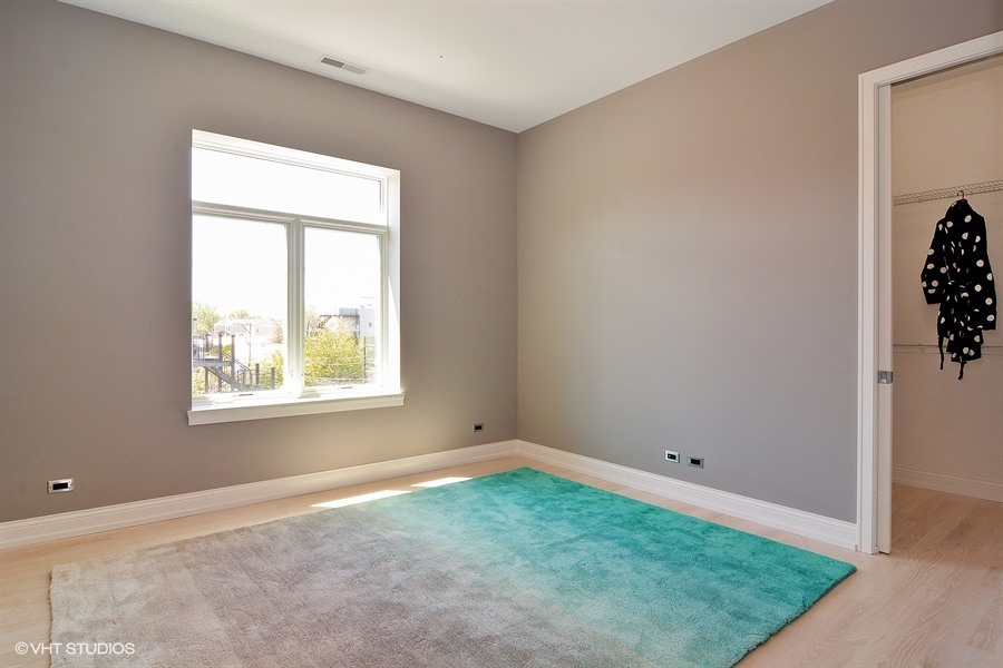 Undisclosed Address Chicago, IL 60622 - Photo 15 of 24 an empty room with a window