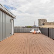 Undisclosed Address Chicago, IL 60622 - Photo 21 of 24 a view of a terrace with wooden floor and television