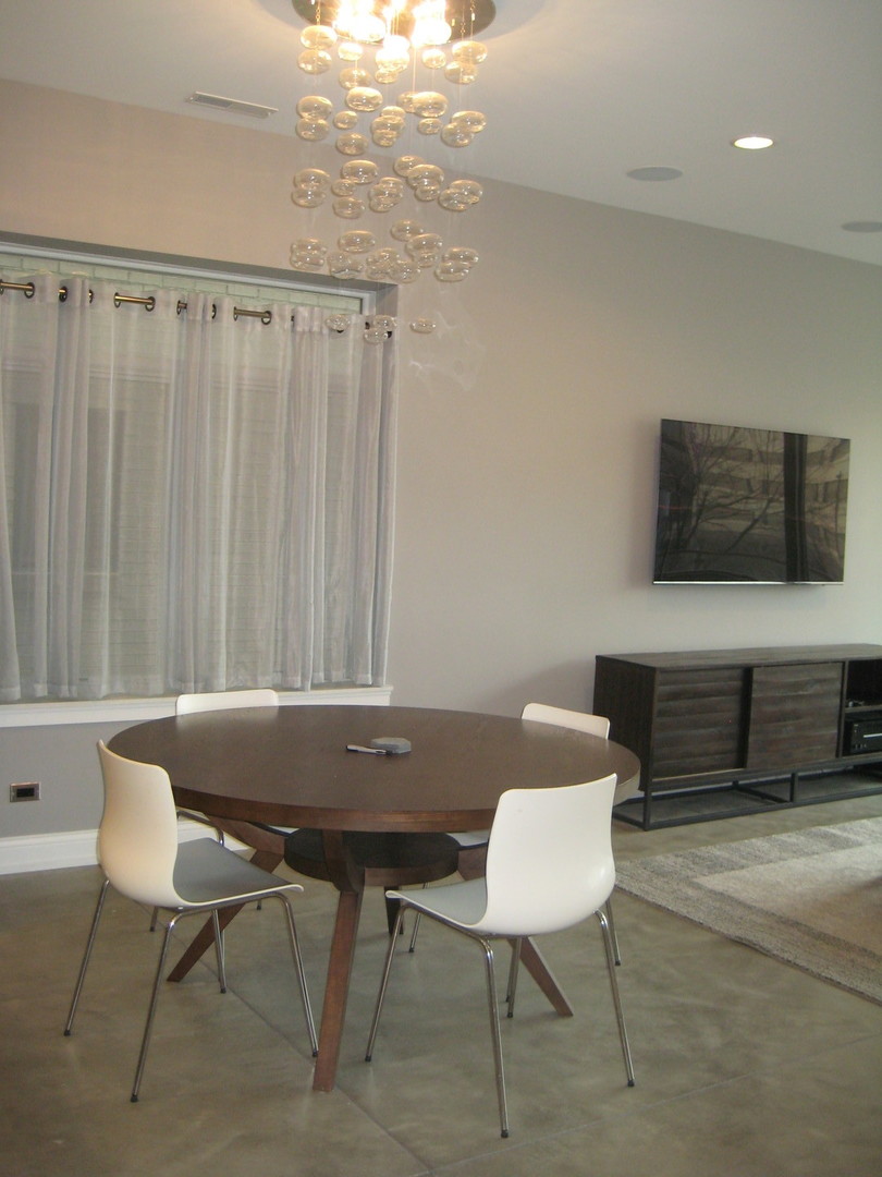 Undisclosed Address Chicago, IL 60622 - Photo 6 of 24 a living room with furniture a flat screen tv and a window