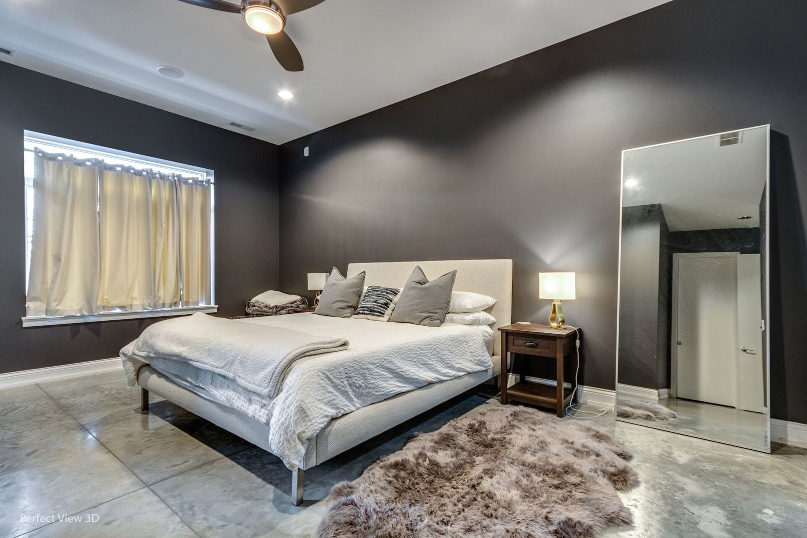 Undisclosed Address Chicago, IL 60622 - Photo 9 of 24 a bedroom with a bed and a dresser with mirror