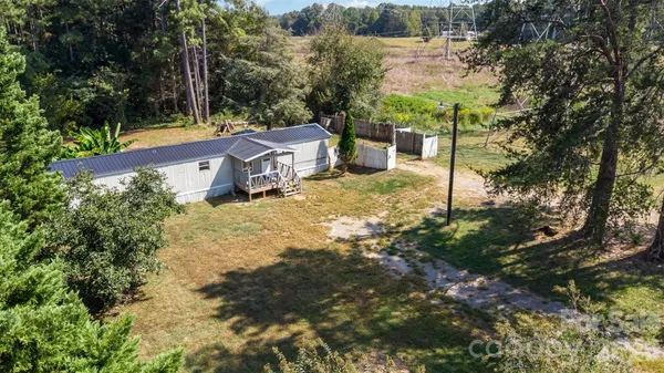a view of house with a yard