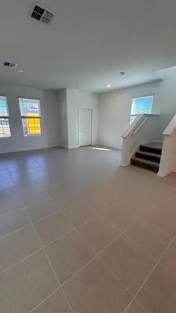 a view of an empty room with a window