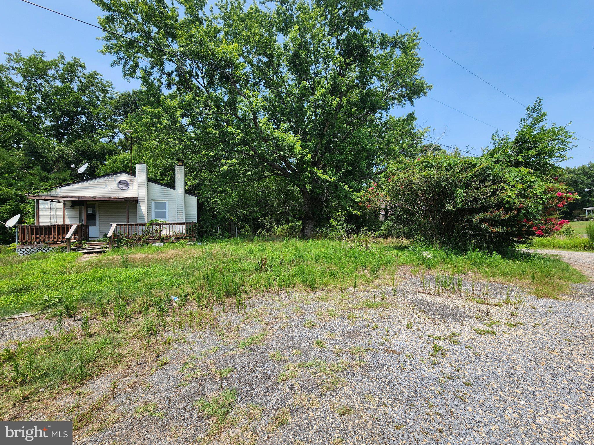 5970 Scaggs Road Owings, MD 20736 - Photo 3 of 23 Charming home nestled in nature's embrace.