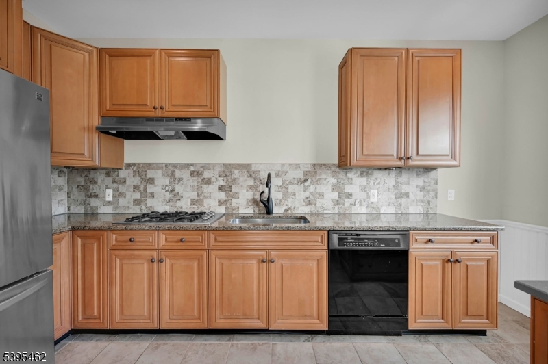 11 Timothy Court Morristown, NJ 07960 - Photo 11 of 30 a kitchen with granite countertop a sink and cabinets
