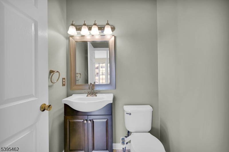 11 Timothy Court Morristown, NJ 07960 - Photo 14 of 30 a bathroom with a toilet sink and mirror