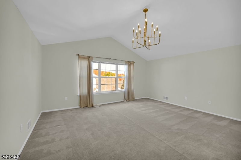 11 Timothy Court Morristown, NJ 07960 - Photo 15 of 30 an empty room with chandelier fan and windows