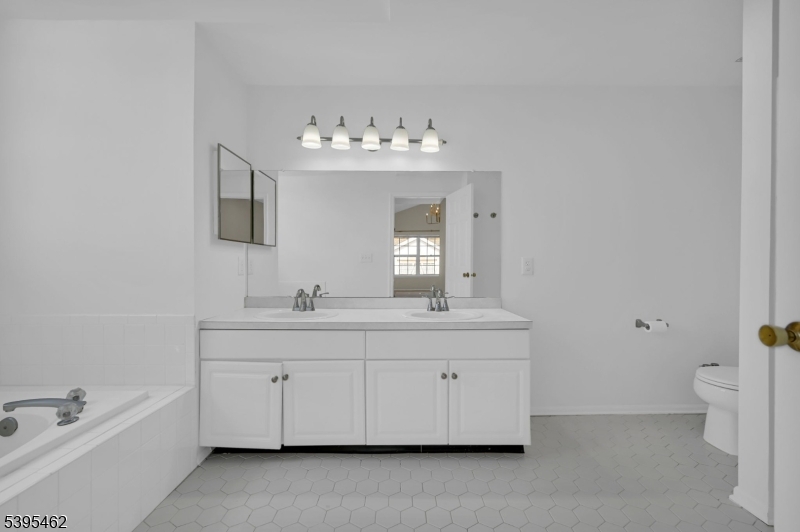 11 Timothy Court Morristown, NJ 07960 - Photo 20 of 30 a bathroom with a double vanity sink mirror and toilet