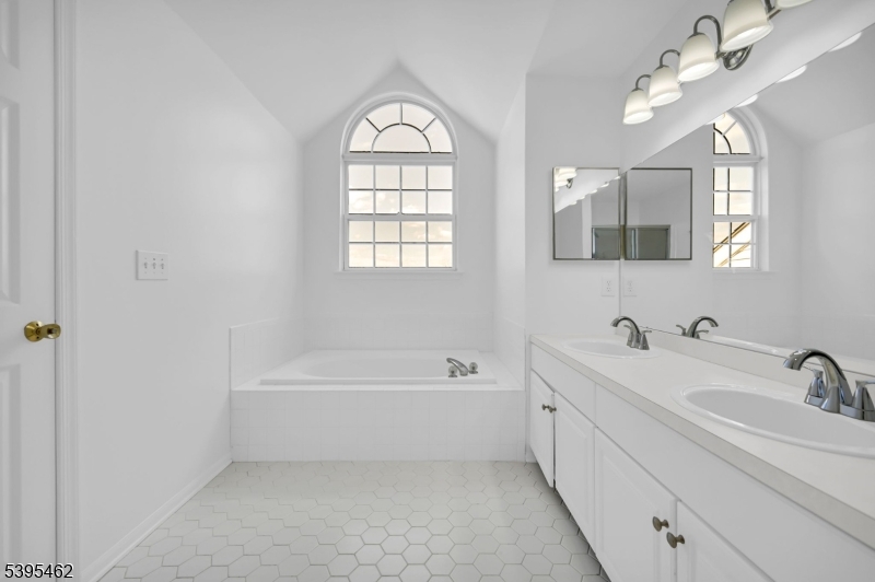 11 Timothy Court Morristown, NJ 07960 - Photo 22 of 30 a bathroom with a bathtub a sink and mirror